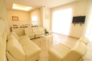 TV a/nebo společenská místnost v ubytování Hotel Miriam