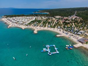 an aerial view of a beach with boats in the water at Terra Park Phalaris in Novalja
