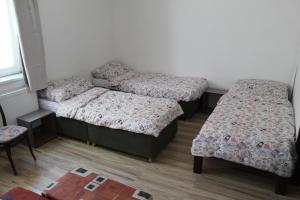 Posteľ alebo postele v izbe v ubytovaní Dusan Apartments