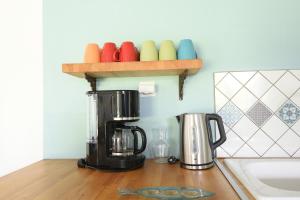 a coffee maker on a counter in a kitchen at Le clos Hadrien Maison de campagne in Greuville