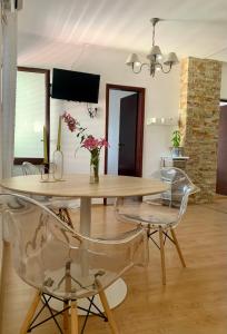 a dining room with a table and chairs at Apartments Herceg Novi in Herceg-Novi