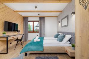 Posteľ alebo postele v izbe v ubytovaní Premium Apartments Salwatoriańska Mountain View Zakopane by Renters Prestige
