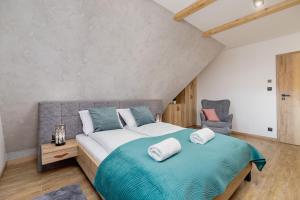 Posteľ alebo postele v izbe v ubytovaní Premium Apartments Salwatoriańska Mountain View Zakopane by Renters Prestige