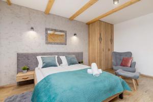 Posteľ alebo postele v izbe v ubytovaní Premium Apartments Salwatoriańska Mountain View Zakopane by Renters Prestige
