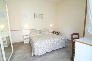 Postel nebo postele na pokoji v ubytování Hotel Miriam