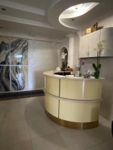 a kitchen with a counter in a room at In hotel in Kamianets-Podilskyi +77 photos