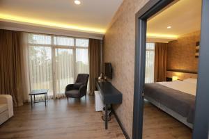 Postel nebo postele na pokoji v ubytování PENTAHOR HOTEL