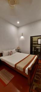 Cama o camas de una habitación en Marari Umapathi Beach Villa
