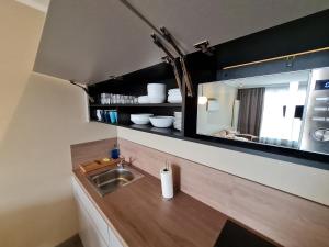 Kuchyňa alebo kuchynka v ubytovaní Apartament Alicia Aqua Resort E 214