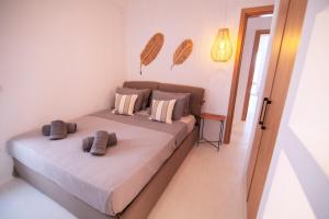 A bed or beds in a room at Villa Piccolo Mondo with private pool and sea view