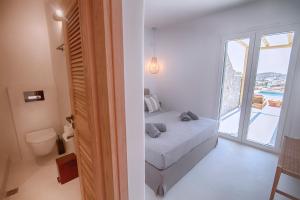 A bed or beds in a room at Villa Piccolo Mondo with private pool and sea view