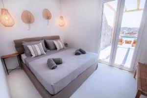 A bed or beds in a room at Villa Piccolo Mondo with private pool and sea view