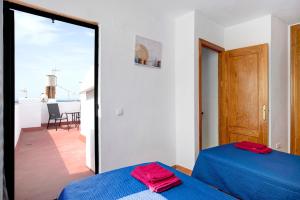 Posteľ alebo postele v izbe v ubytovaní Apartamento Azucenas