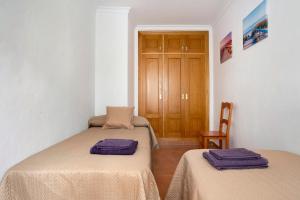 Posteľ alebo postele v izbe v ubytovaní Apartamento Azucenas