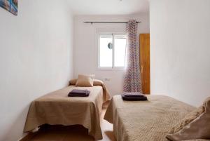 Posteľ alebo postele v izbe v ubytovaní Apartamento Azucenas