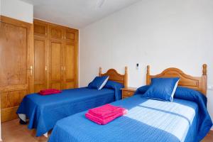 Posteľ alebo postele v izbe v ubytovaní Apartamento Azucenas