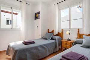 Posteľ alebo postele v izbe v ubytovaní Apartamento Azucenas