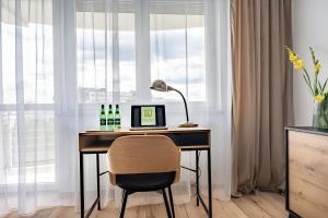 Televízia a/alebo spoločenská miestnosť v ubytovaní Grelewicz Apartments- MyPleasure
