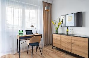 Televízia a/alebo spoločenská miestnosť v ubytovaní Grelewicz Apartments- MyPleasure + 6 fotografií
