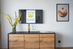 TV a/nebo společenská místnost v ubytování Grelewicz Apartments- MyPleasure