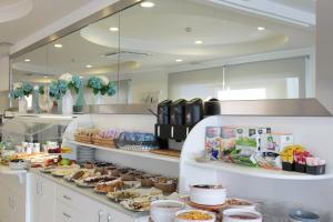 a buffet line with many different types of food at Hotel Bristol in Caorle