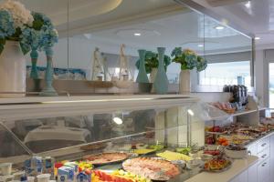 a buffet line with many different types of food at Hotel Bristol in Caorle