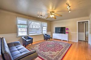 a living room with a couch and a tv at \Sun-Dappled Retreat Walk to Restaurants! in Boulder Creek