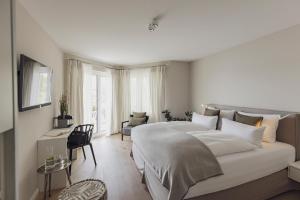 Postel nebo postele na pokoji v ubytování Hotel Caraleon + 37 fotografií