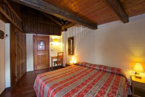 Postel nebo postele na pokoji v ubytování Hotel Dolonne