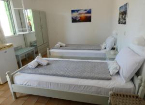 Postel nebo postele na pokoji v ubytování Το Κατἑ