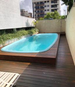 a swimming pool on the deck of a building at Residence 207 Cabo Branco in João Pessoa