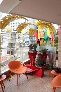 a group of umbrellas in front of a window at Millennials in Manizales