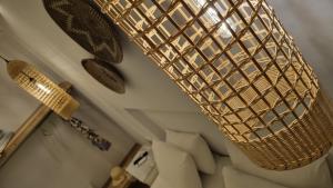 a large chandelier hanging from the ceiling in a room at Hotel Alexandra in Skala