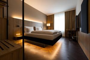 Postel nebo postele na pokoji v ubytování GINN City & Lounge Yorck Berlin