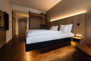 Postel nebo postele na pokoji v ubytování GINN City & Lounge Yorck Berlin