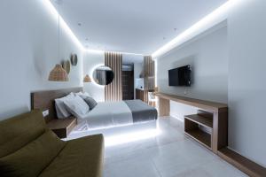 TV a/nebo společenská místnost v ubytování Ammos Luxury Apartments
