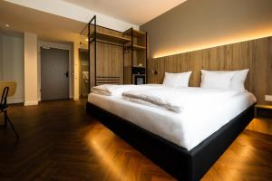 Postel nebo postele na pokoji v ubytování GINN City & Lounge Yorck Berlin