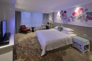 TV a/nebo společenská místnost v ubytování Paco Hotel Beijing Road Tuan Yi Da Metro Guangzhou