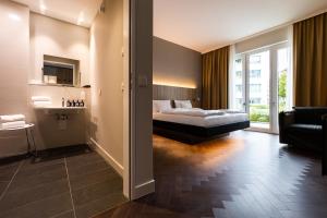 Postel nebo postele na pokoji v ubytování GINN City & Lounge Yorck Berlin