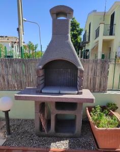 a brick oven sitting on top of a table at La Gioia di Casa in Àrbatax