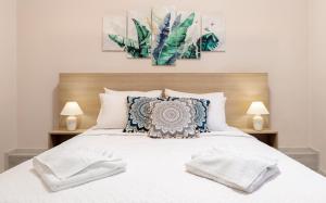 Posteľ alebo postele v izbe v ubytovaní Strat's City Loft