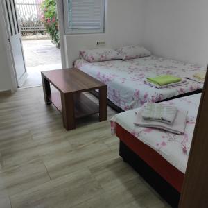 Apartment Perutović客房内的一张或多张床位
