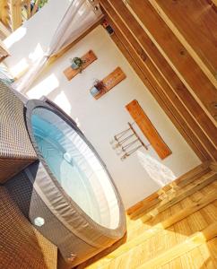 an overhead view of a room with a mirror at Studio de charme avec piscine de relaxation in Moyaux