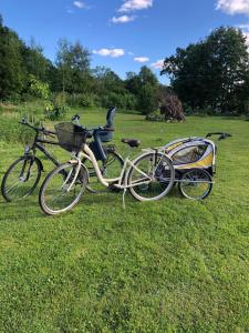 two bikes parked on the grass in a field at Lahemaa Glamping in Viinistu