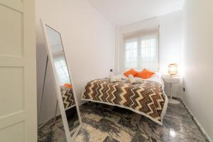 Postel nebo postele na pokoji v ubytování Exclusivo Piso Granada, PARKING PRIVADO OPCIONAL