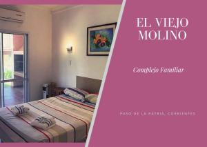 a poster of a bedroom with a bed and a window at Complejo Familiar EL VIEJO MOLINO in Paso de la Patria