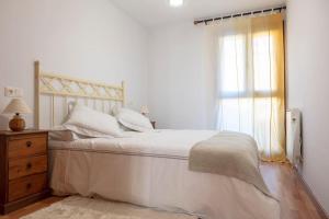 Кровать или кровати в номере Coqueto apartamento en Valdelinares