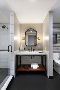 a bathroom with a sink and a mirror at Hewing Hotel in Minneapolis
