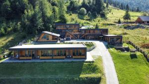 an aerial view of a house on a hill at Panoramic Residence in Borşa