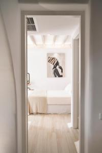 Postel nebo postele na pokoji v ubytování Hyperion Villa by LLB Mykonos